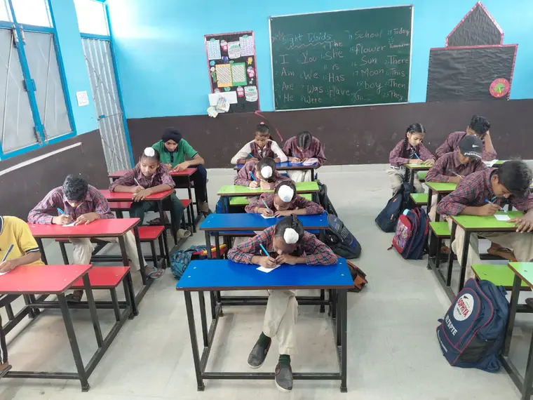 Students writing individual reflections at their desks