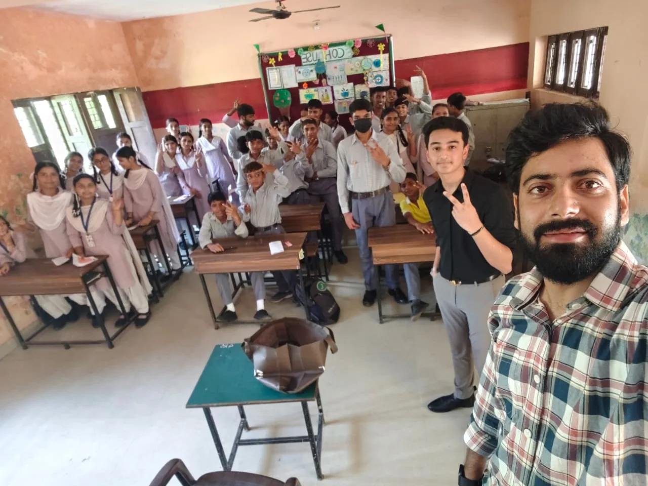 Students and an Avana facilitator in their classroom
