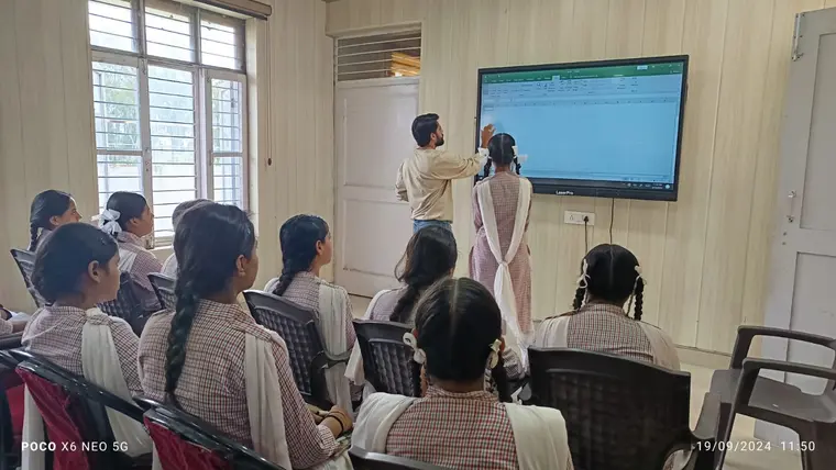Facilitator demonstrating a spreadsheet on a shared screen